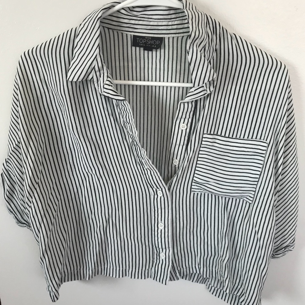 Button down, short sleeve blouse.